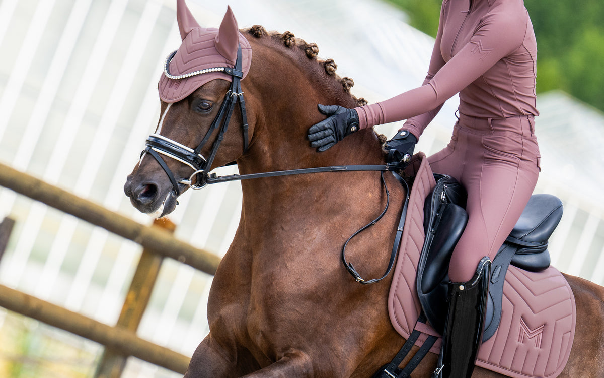 AW26 Heather, young rider on a pony in Heather base layer, leggings and matching saddle pad